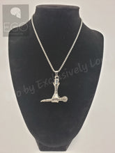Load image into Gallery viewer, A silver pendant necklace featuring a stylized figure holding a microphone, displayed on a black velvet jewelry bust against a light gray background.
